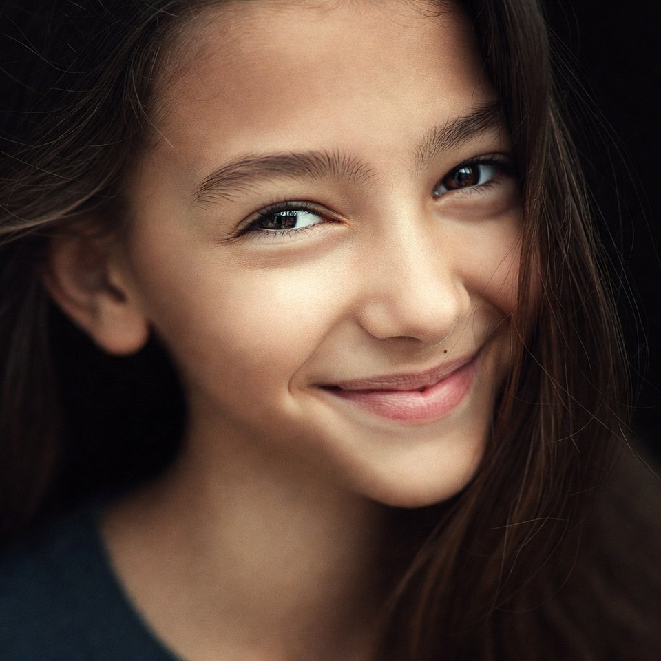 Smiling girl with long brown hair Smiling girl with long brown hair