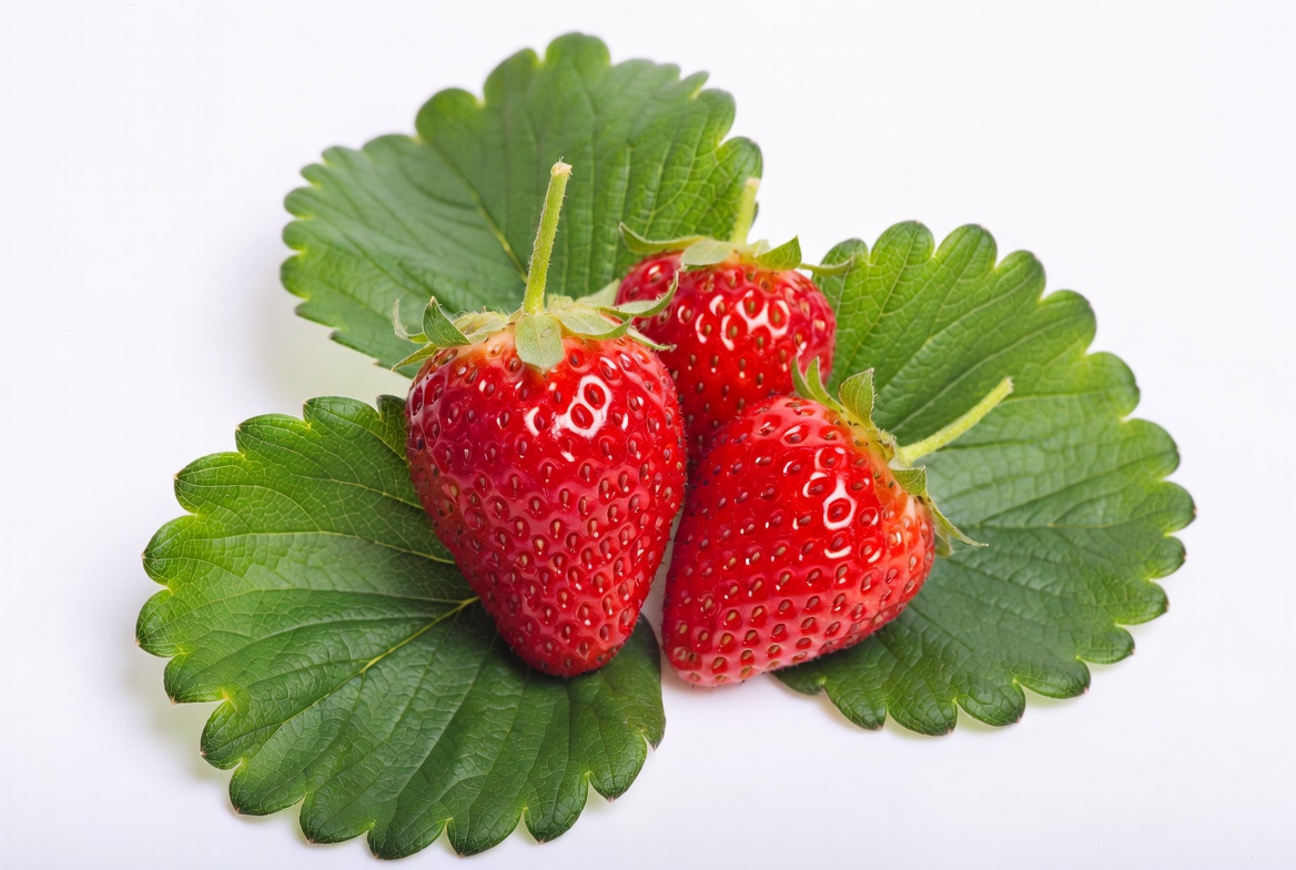 Fresh Strawberries with Green Leaves Fresh Strawberries with Green Leaves