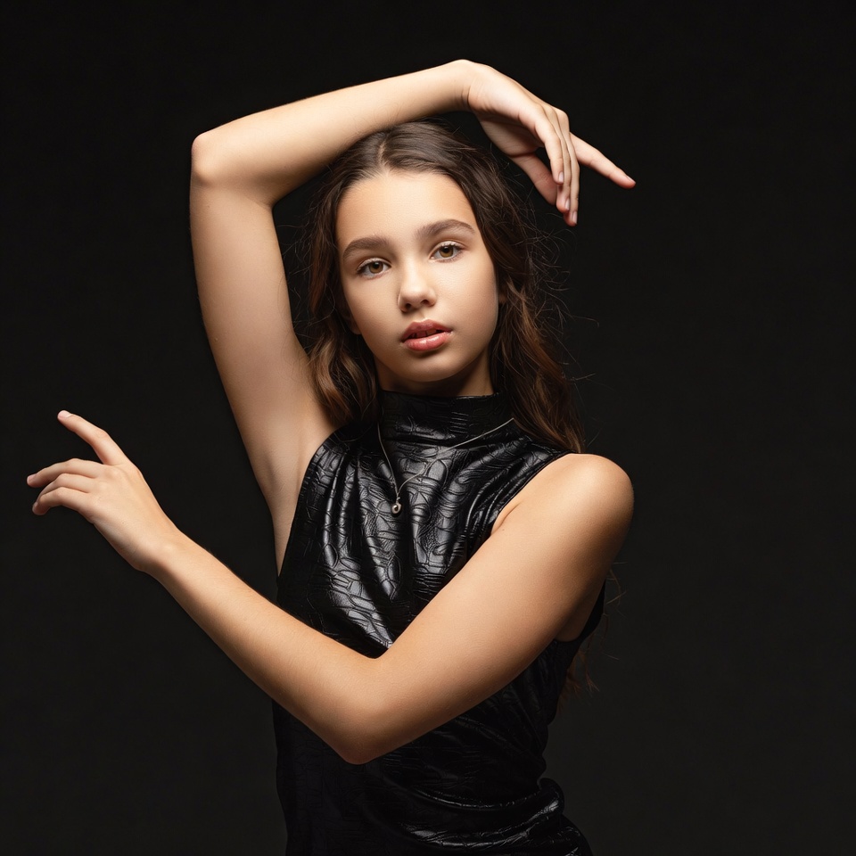 Young woman posing in black leather top Young woman posing in black leather top