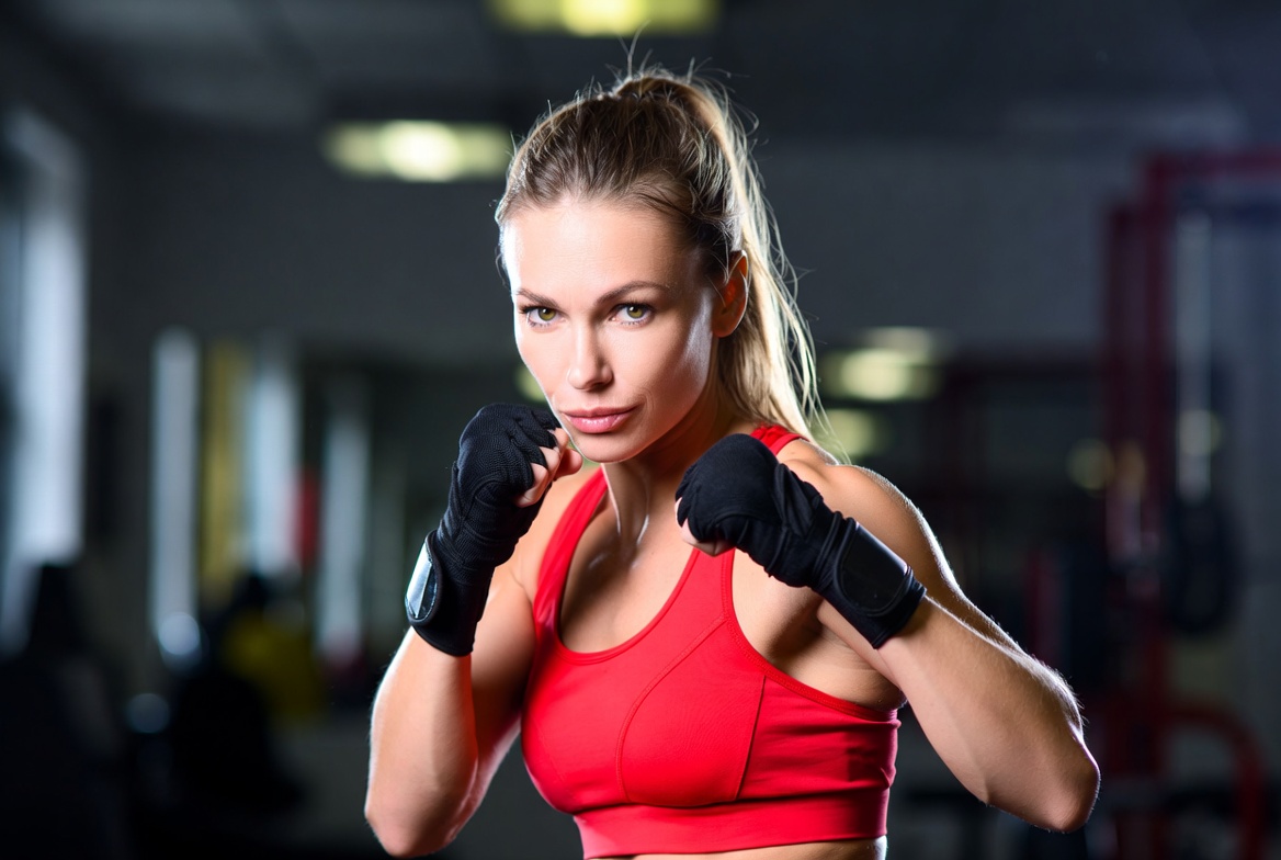 Woman boxer with red sports bra Woman boxer with red sports bra
