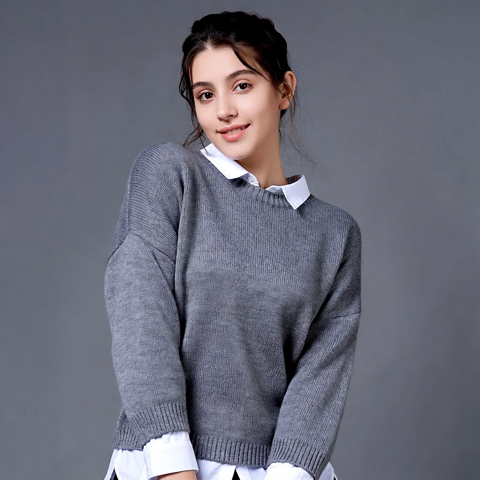 Young woman in gray sweater Young woman in gray sweater