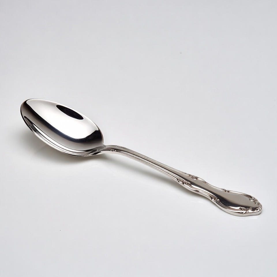 Shiny silver spoon on white background Shiny silver spoon on white background