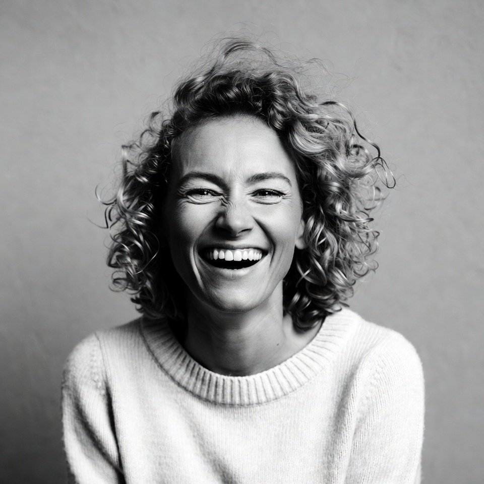 Woman laughing with curly hair Woman laughing with curly hair