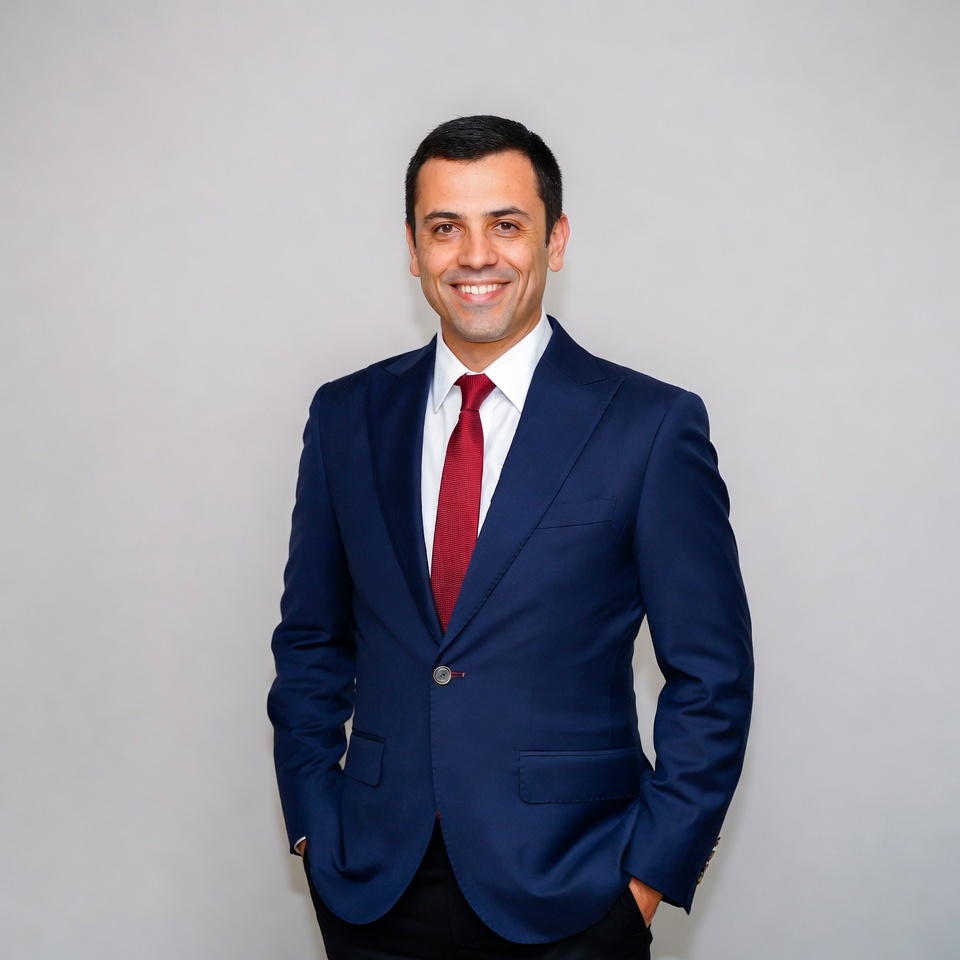 Man in navy suit with red tie Man in navy suit with red tie