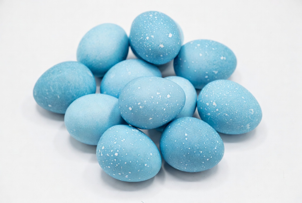 Blue speckled Easter eggs pile Blue speckled Easter eggs pile