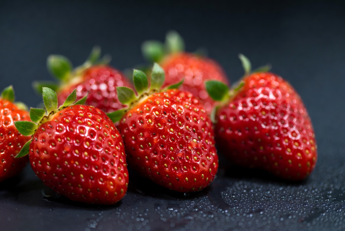 Fresh Strawberries on Black Background Fresh Strawberries on Black Background