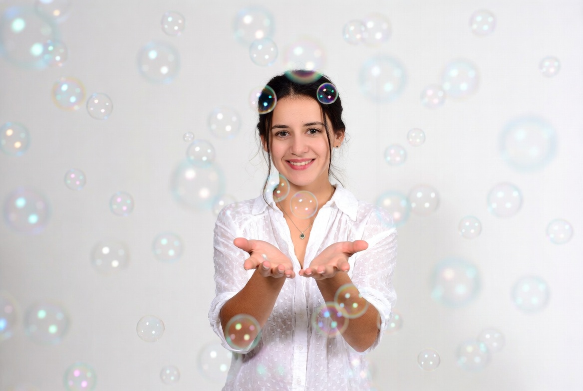 Woman holding soap bubbles Woman holding soap bubbles
