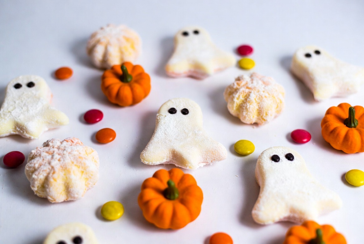 Ghost and Pumpkin Marshmallows on White Background Ghost and Pumpkin Marshmallows on White Background