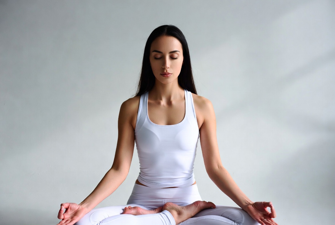 Woman meditating in lotus pose Woman meditating in lotus pose