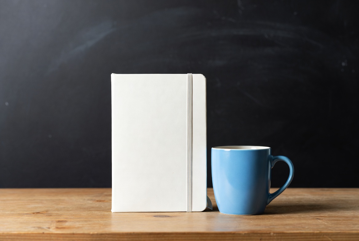 White Notebook and Blue Mug White Notebook and Blue Mug
