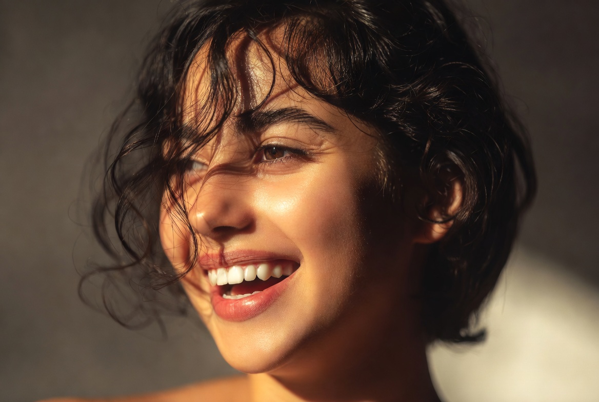 Smiling woman with curly hair Smiling woman with curly hair