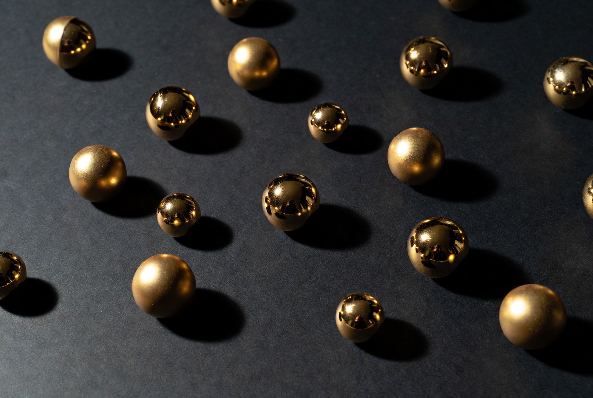 Golden metallic balls on black background Golden metallic balls on black background