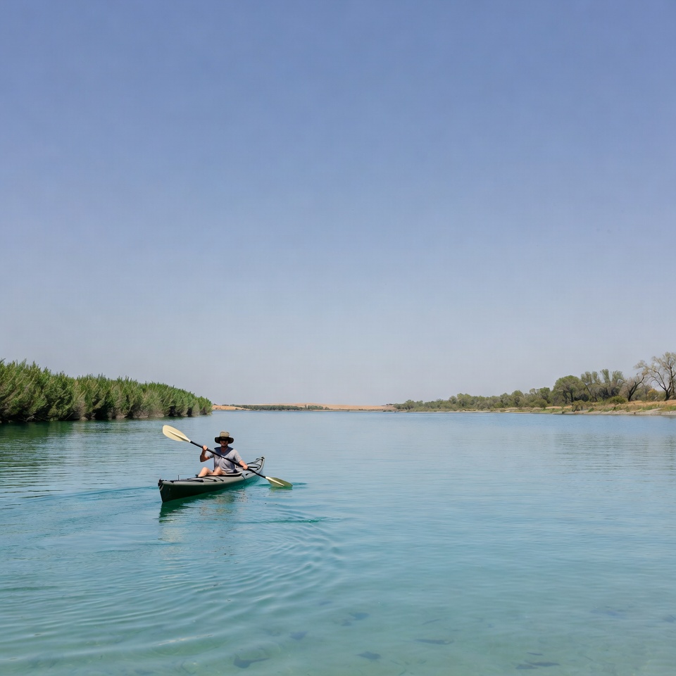 Man kayaking on river Man kayaking on river