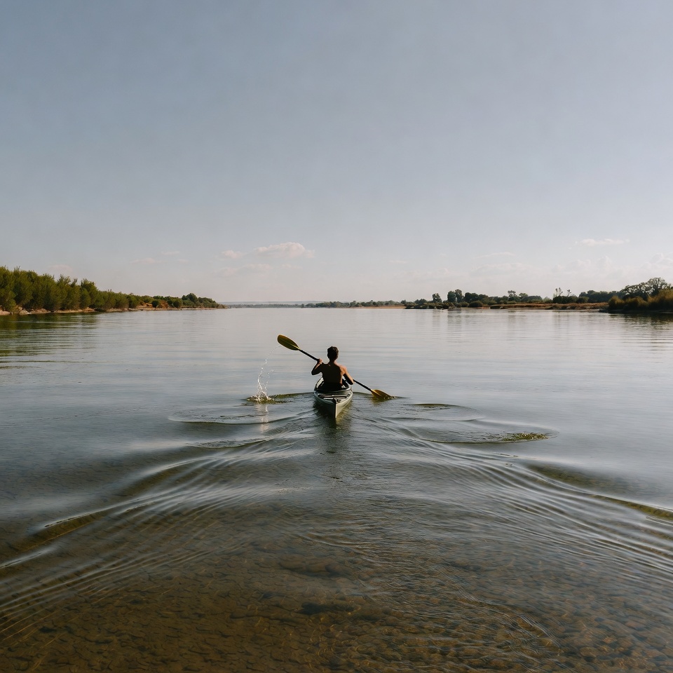 Man kayaking on calm river Man kayaking on calm river