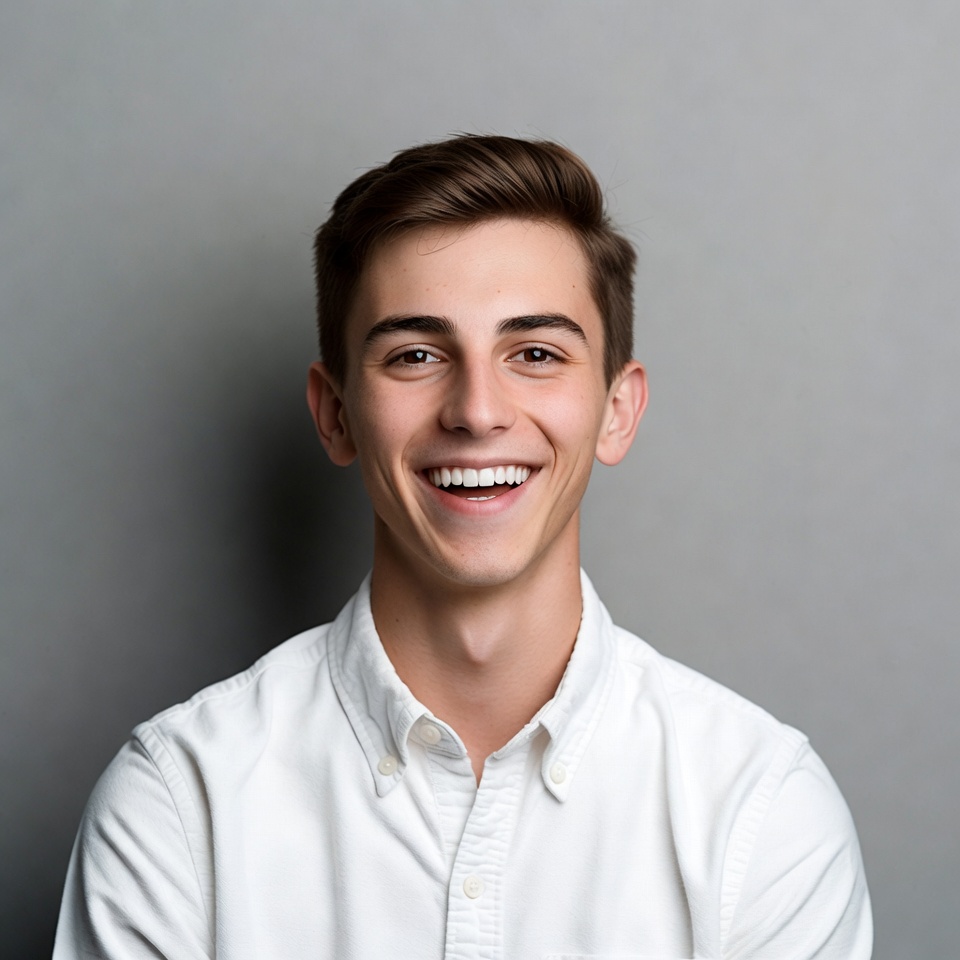 Smiling young man in white shirt Smiling young man in white shirt