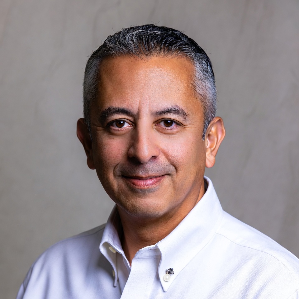 Smiling Middle Eastern man in white shirt Smiling Middle Eastern man in white shirt