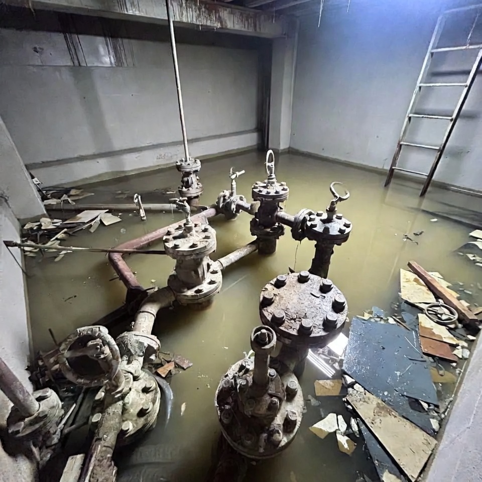 Flooded Abandoned Basement with Rusty Pipes Flooded Abandoned Basement with Rusty Pipes