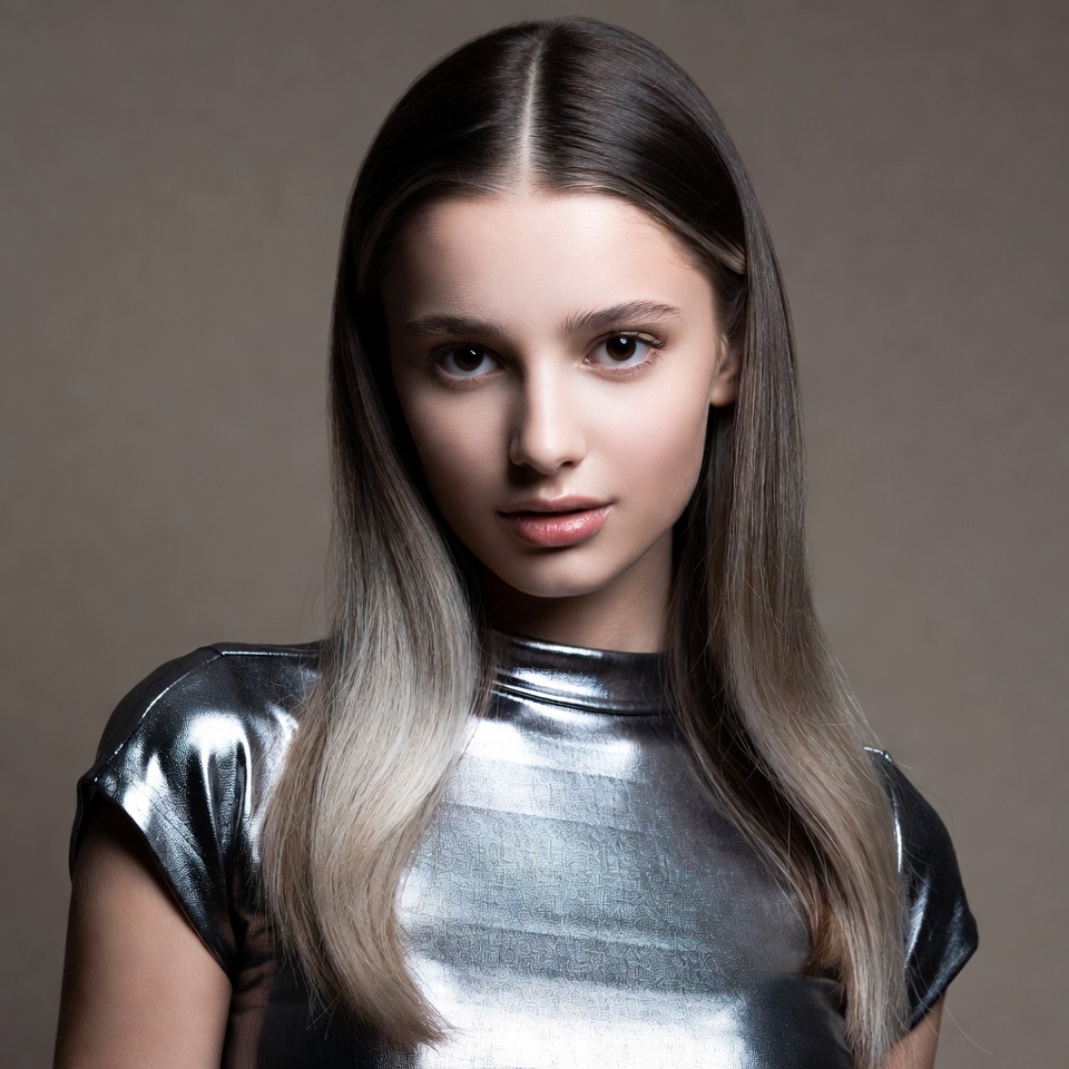 Young woman in silver top Young woman in silver top