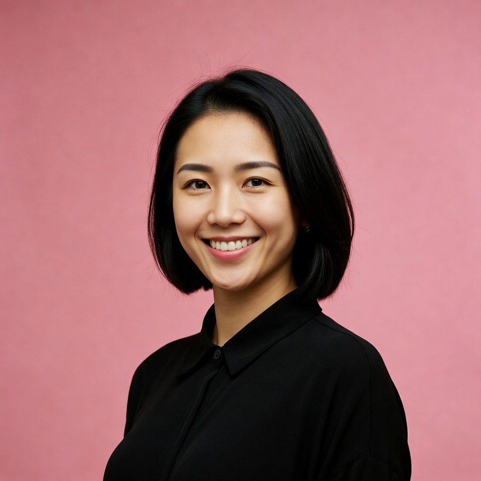 Asian woman smiling on pink background Asian woman smiling on pink background