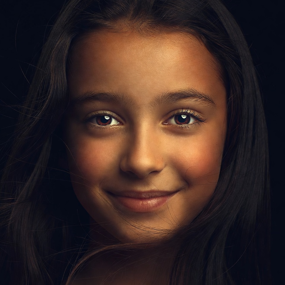 Smiling mixed-race girl close-up Smiling mixed-race girl close-up