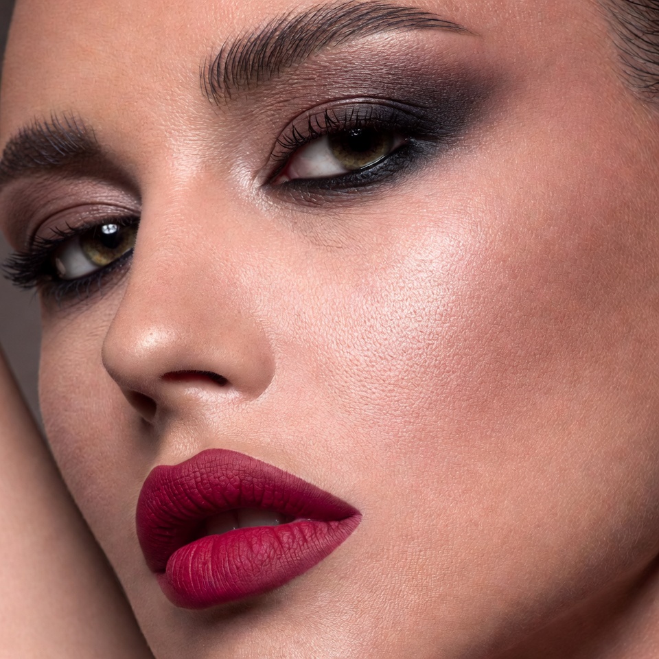 Woman with dramatic smoky eyes and red lips Woman with dramatic smoky eyes and red lips