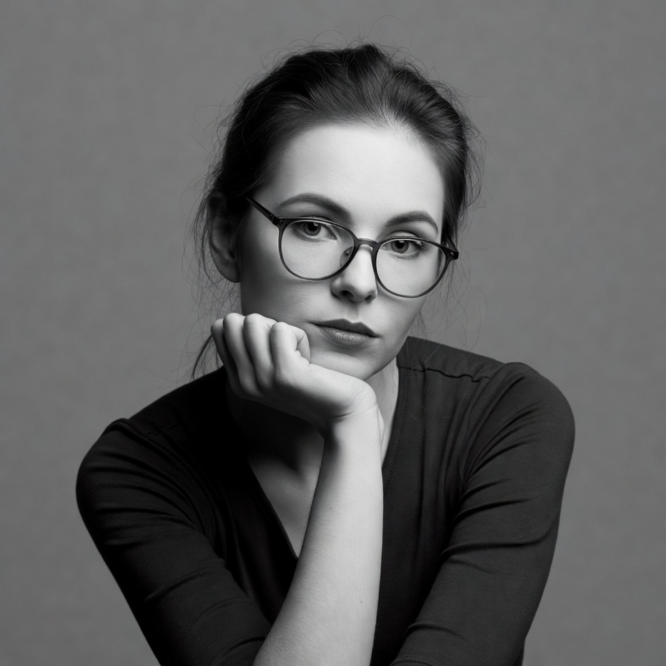 Woman with glasses hand on chin Woman with glasses hand on chin