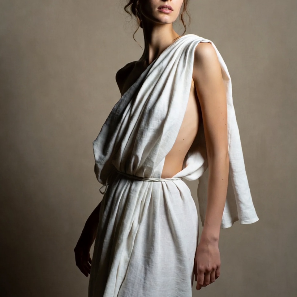 Woman in white draped toga Woman in white draped toga