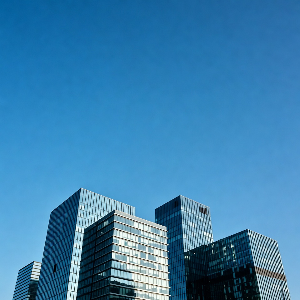 Modern glass skyscrapers against blue sky Modern glass skyscrapers against blue sky