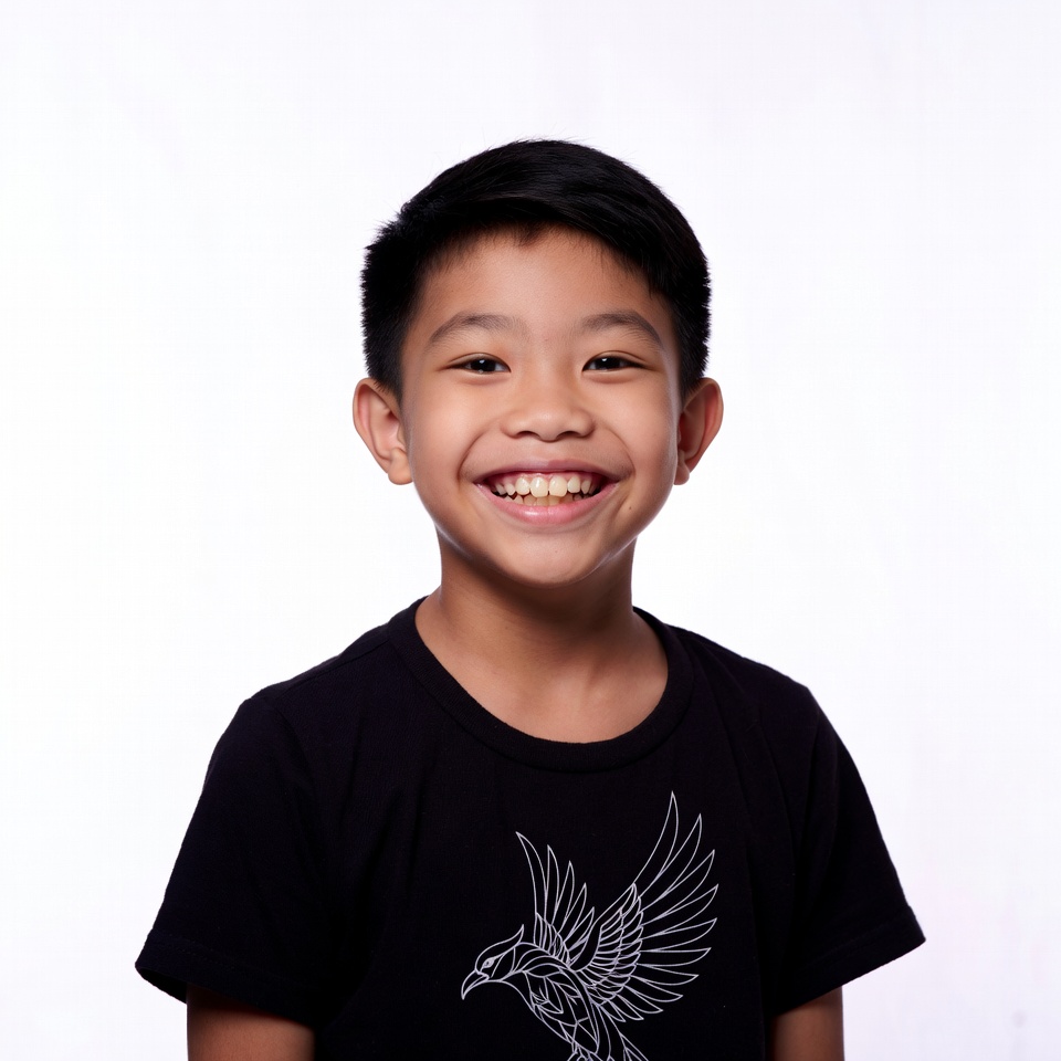 Asian boy smiling in bird t-shirt Asian boy smiling in bird t-shirt