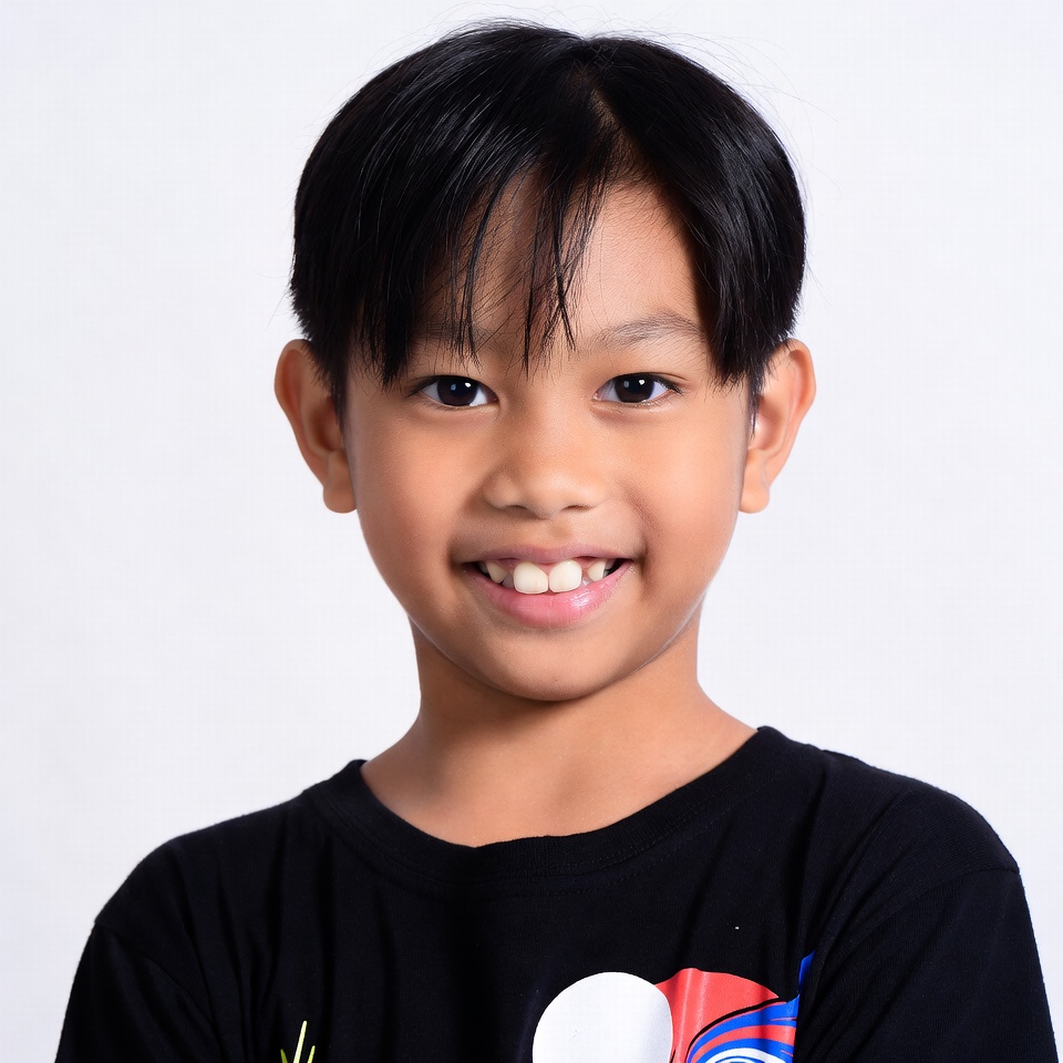Asian boy smiling on white background Asian boy smiling on white background