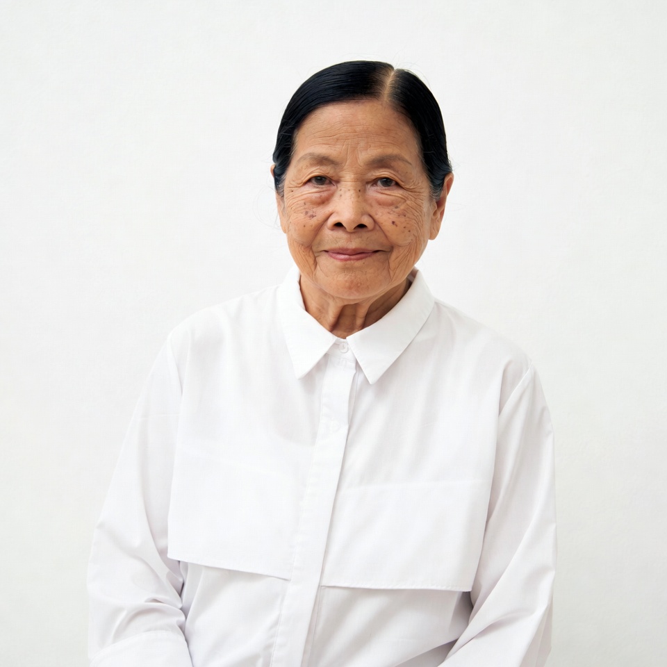 Elderly Asian woman in white shirt Elderly Asian woman in white shirt