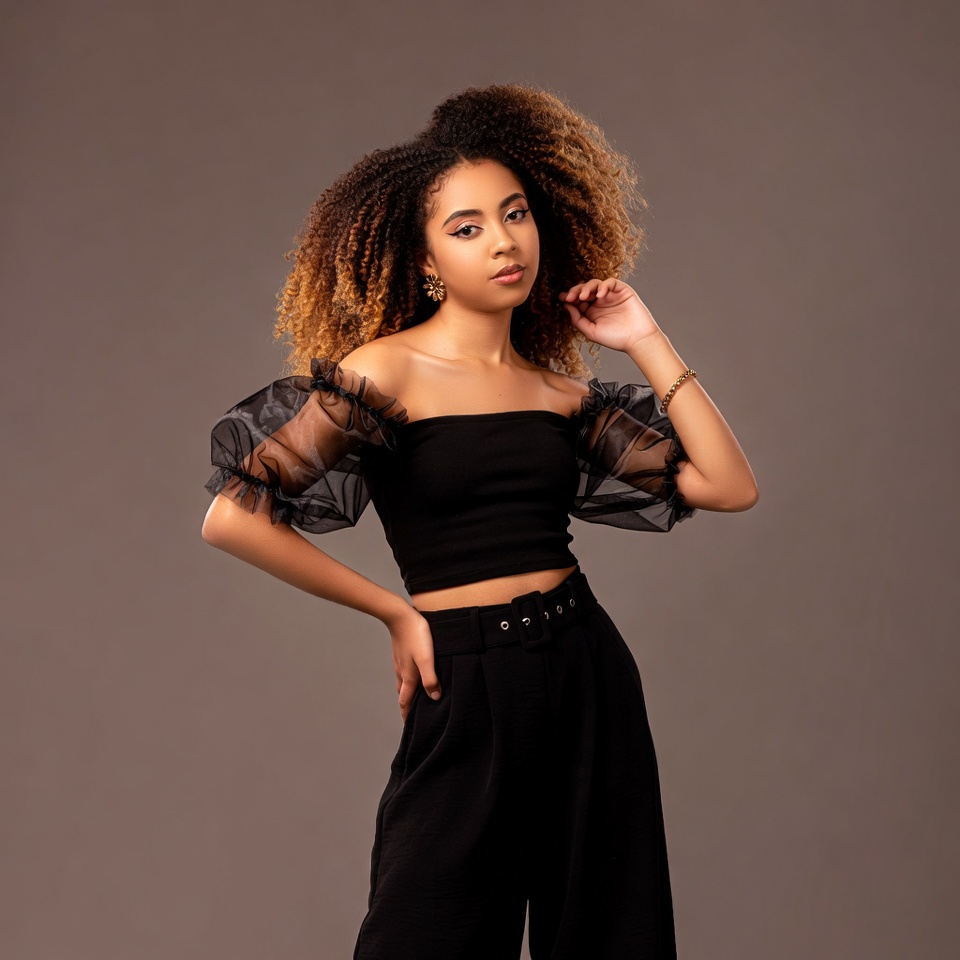 Young Black woman in sheer black top Young Black woman in sheer black top