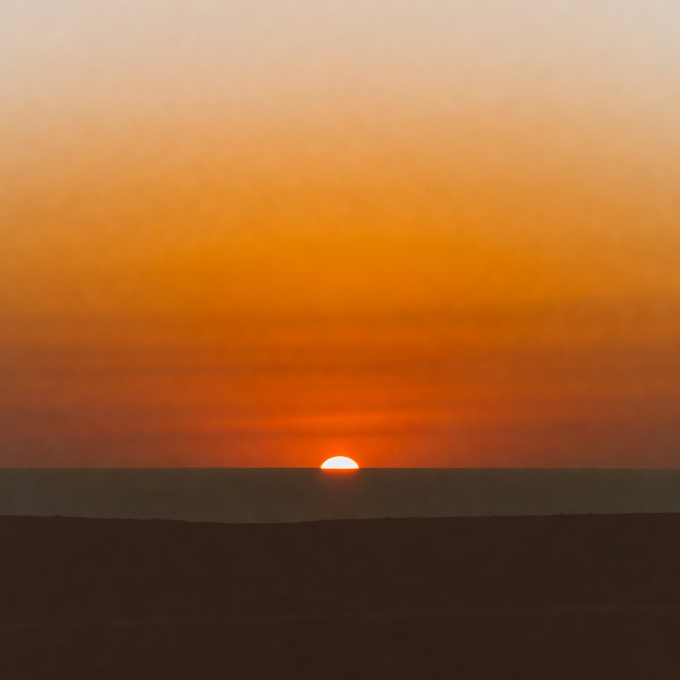 Sunset over ocean horizon Sunset over ocean horizon