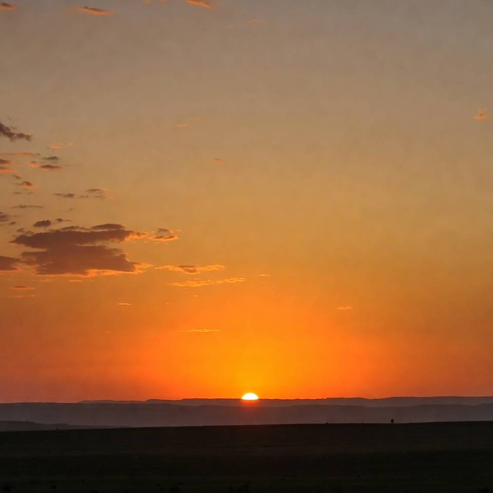 Sunset over vast grassy plain Sunset over vast grassy plain