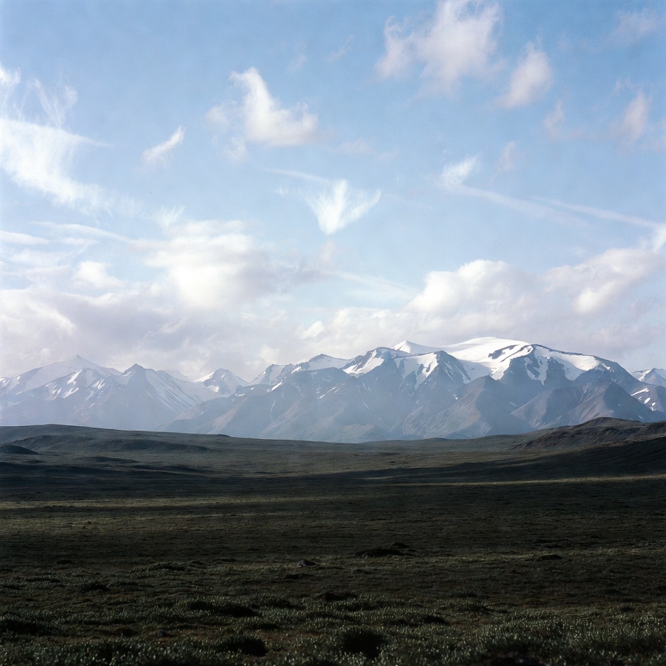 Snowy Mountains Over Vast Plain Snowy Mountains Over Vast Plain