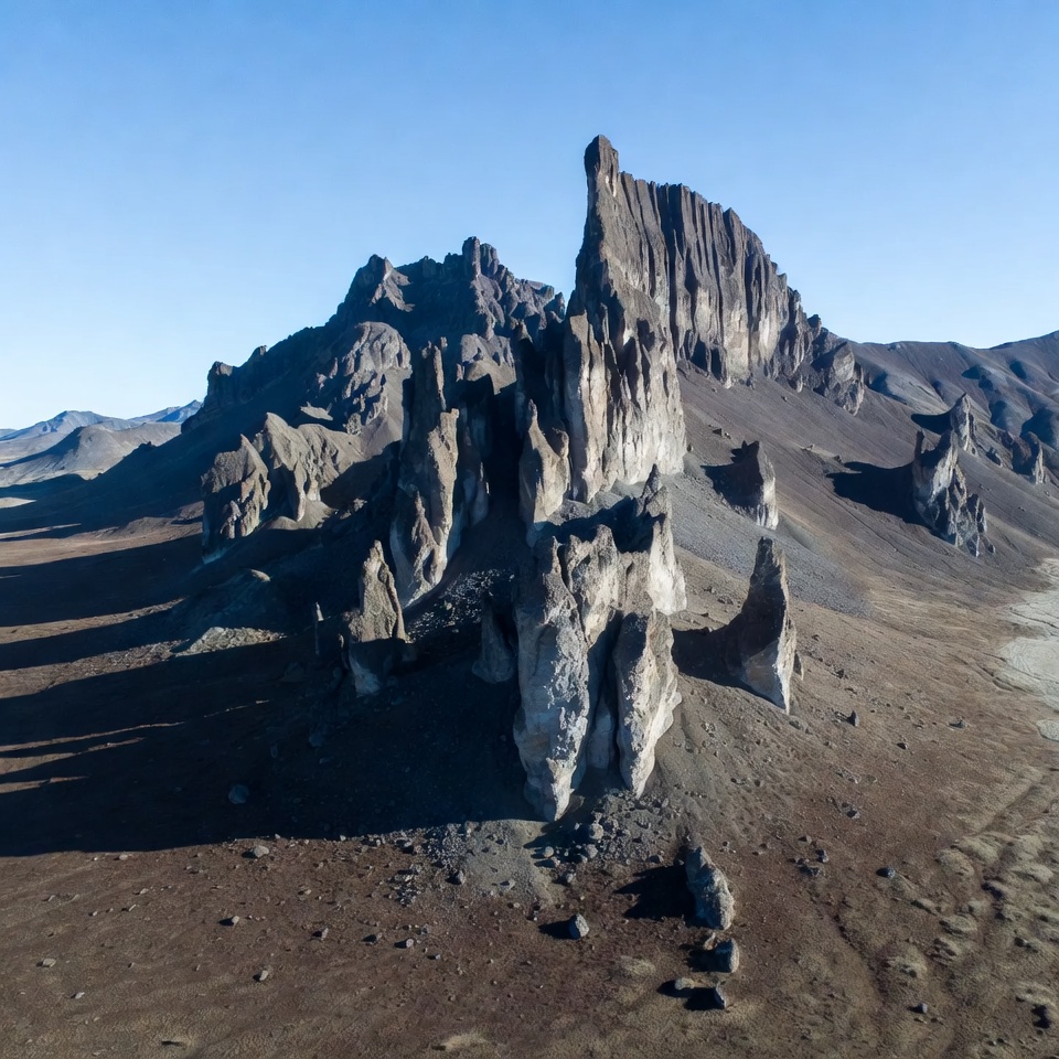 Towering rock formations in desert landscape Towering rock formations in desert landscape
