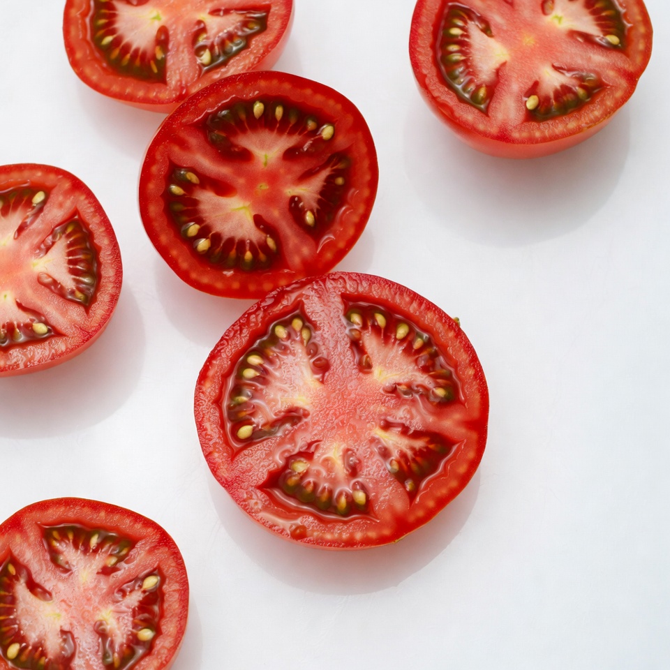 Sliced Tomatoes on White Background Sliced Tomatoes on White Background