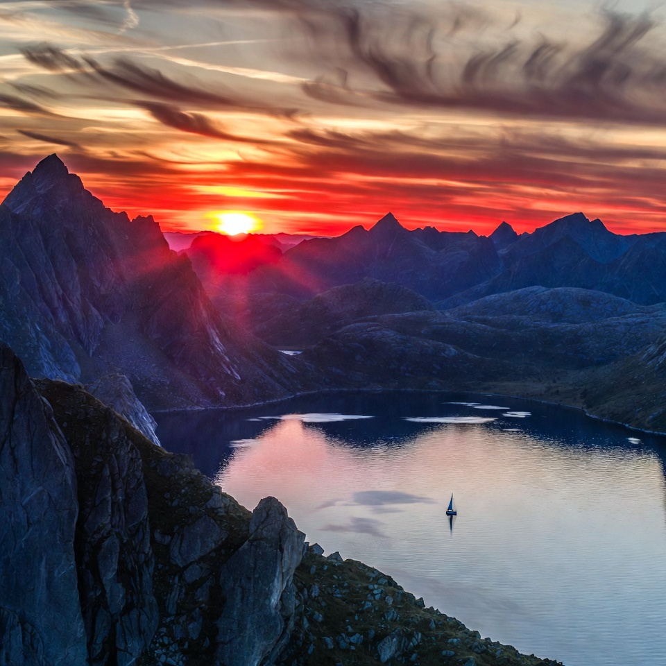 Sailboat on lake at sunset mountains Sailboat on lake at sunset mountains