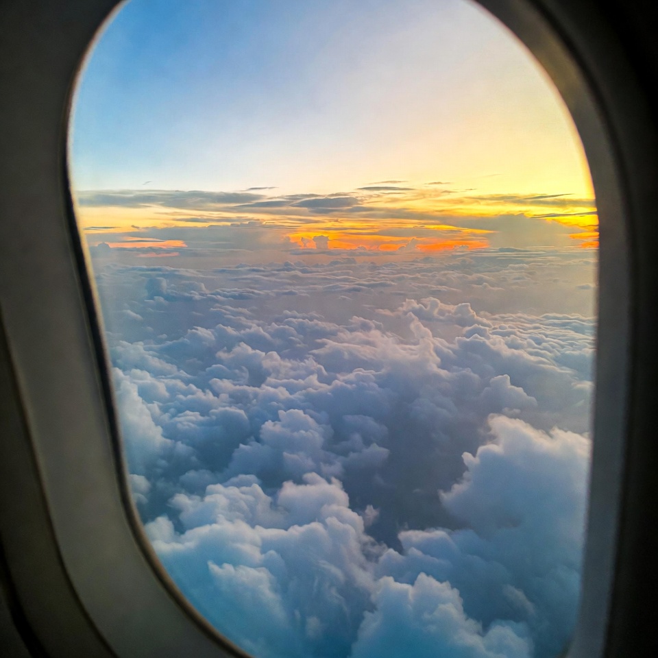 Airplane Window Sunset Over Clouds Airplane Window Sunset Over Clouds