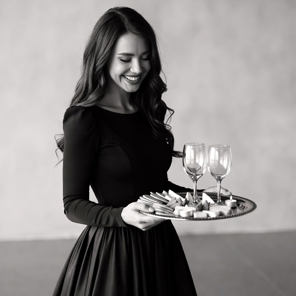 Woman holding tray with wine glasses Woman holding tray with wine glasses