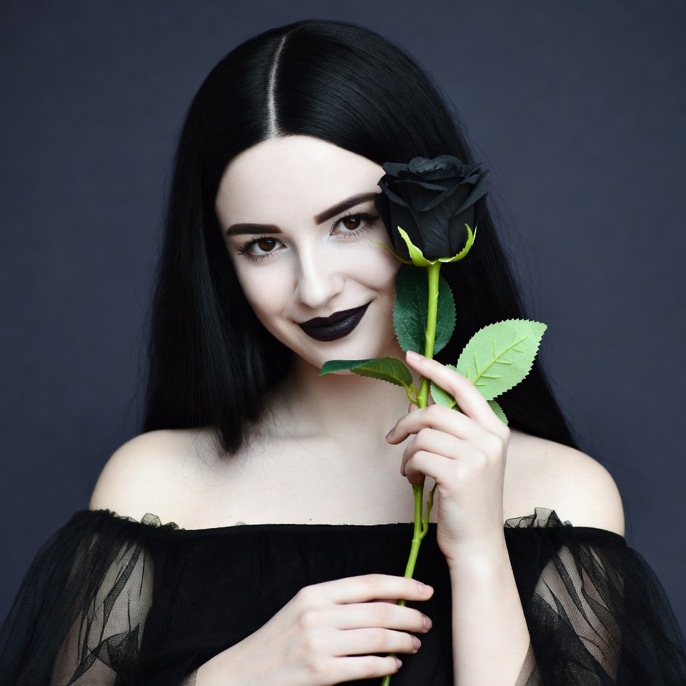Woman holding black rose Woman holding black rose
