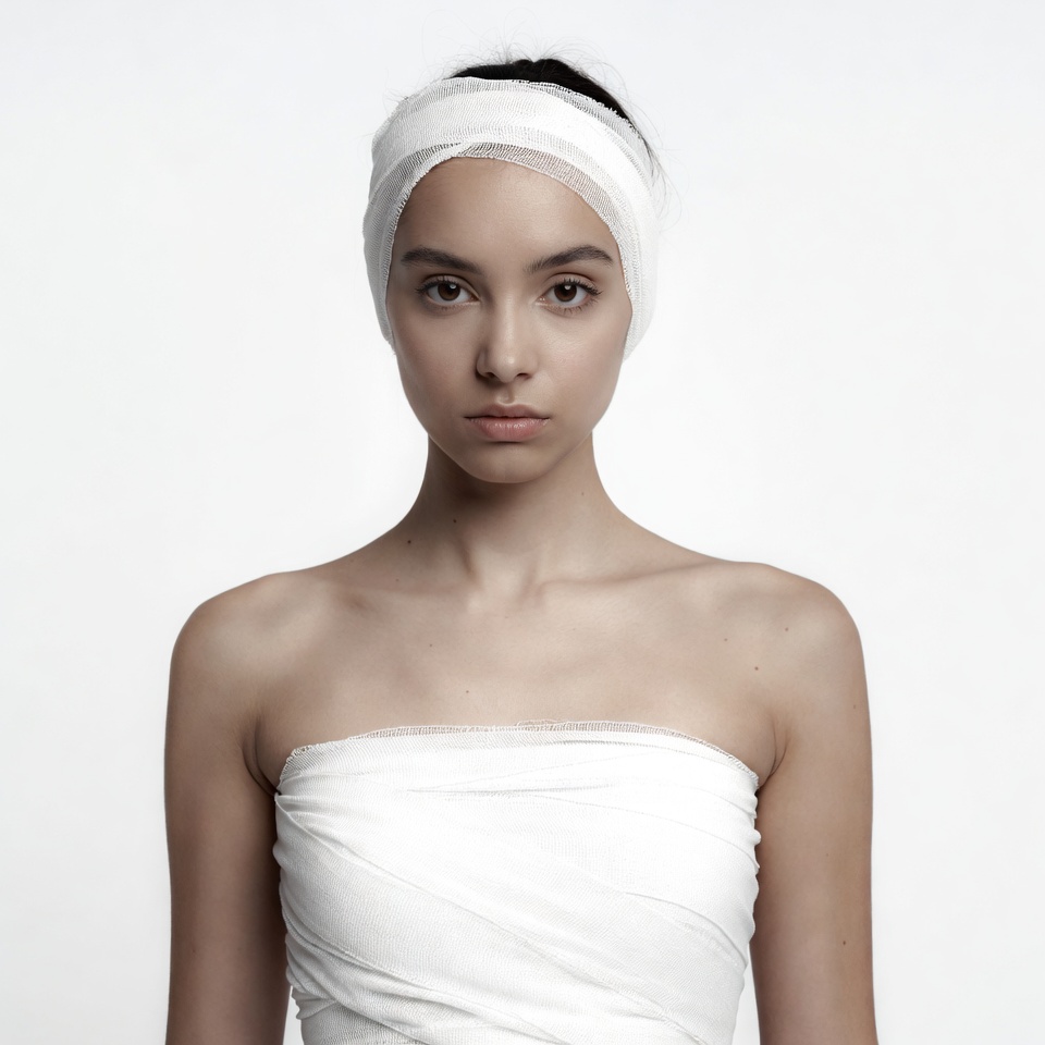 Woman wrapped in white bandages Woman wrapped in white bandages