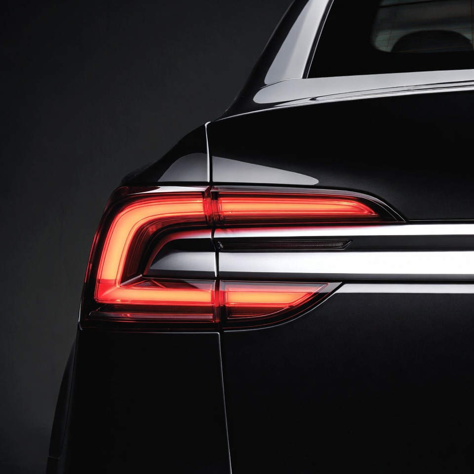 Black Sedan Rear with Glowing Red Taillights Black Sedan Rear with Glowing Red Taillights