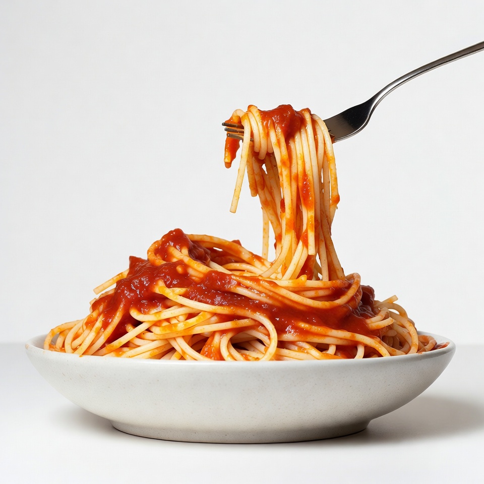 Spaghetti with tomato sauce on fork Spaghetti with tomato sauce on fork