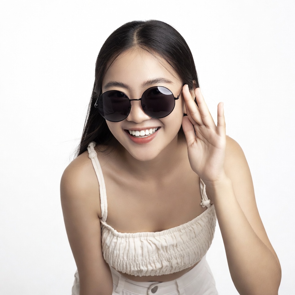Asian woman waving in sunglasses Asian woman waving in sunglasses