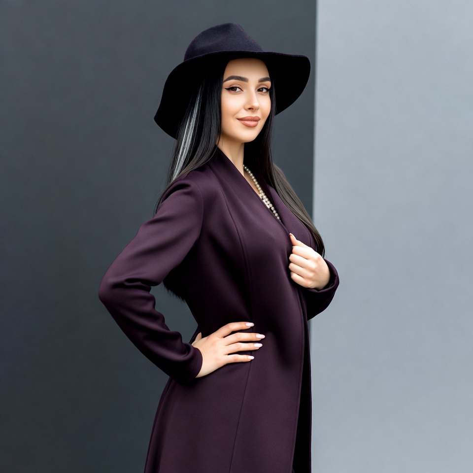 Woman in black hat and purple coat Woman in black hat and purple coat