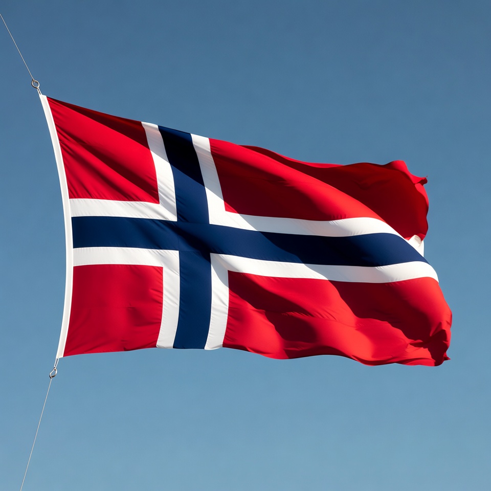 Norwegian flag waving against blue sky Norwegian flag waving against blue sky