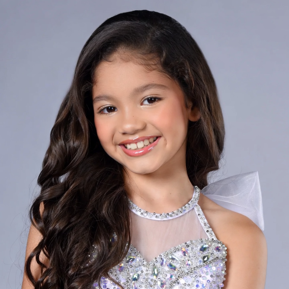 Smiling Asian girl in sparkly dress Smiling Asian girl in sparkly dress