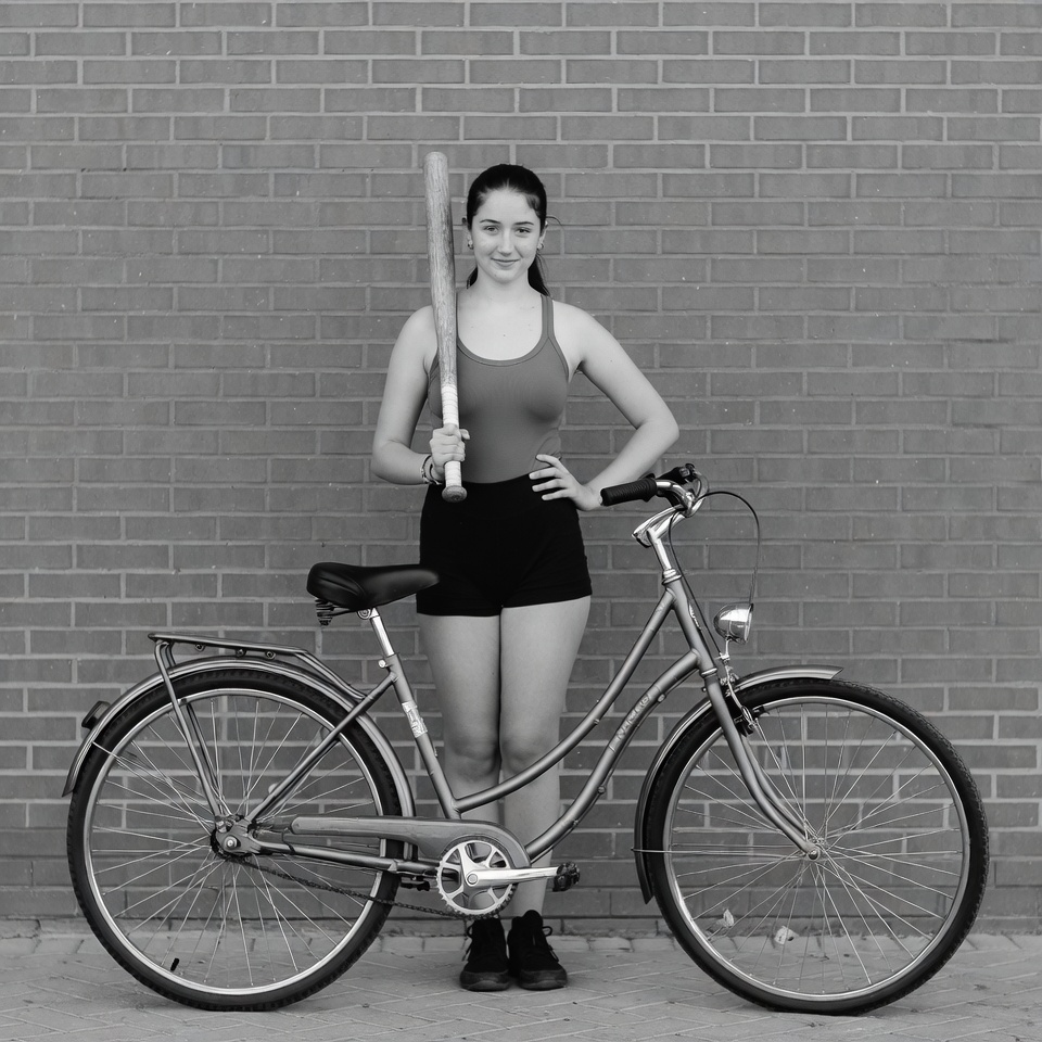 Woman with bat and bicycle Woman with bat and bicycle