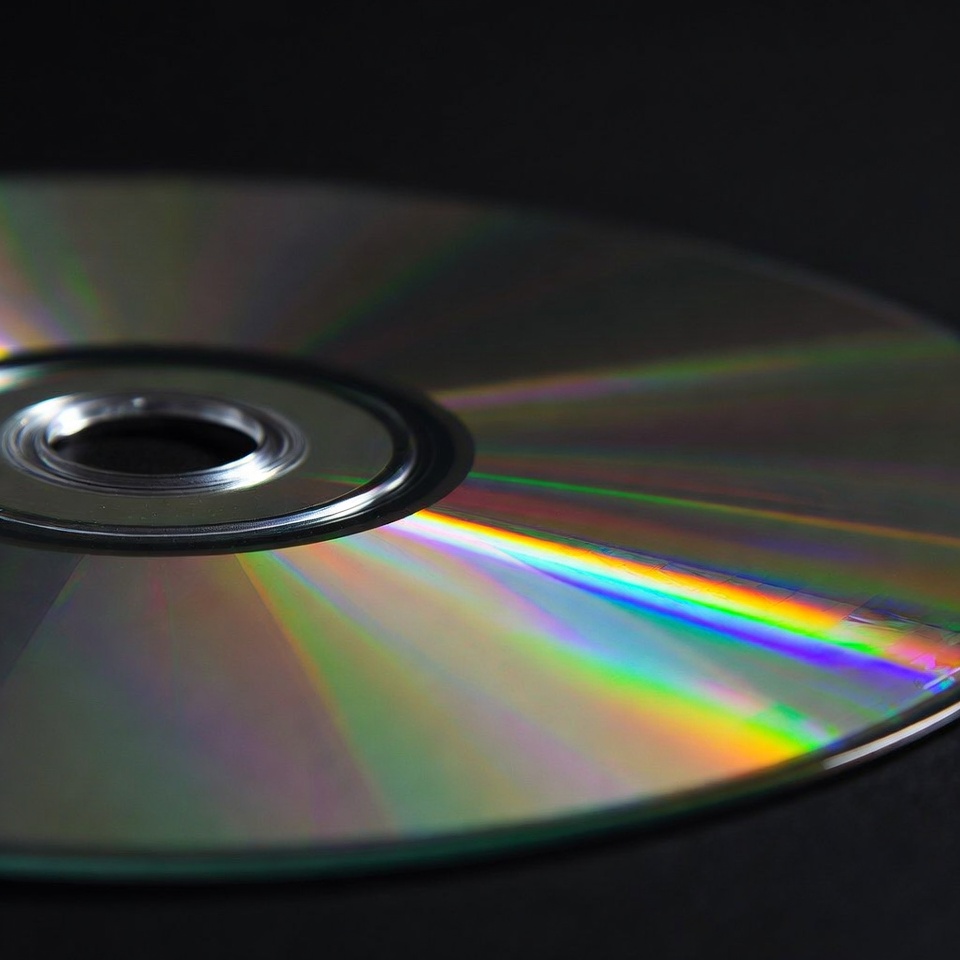 Shiny CD Disc on Black Background Shiny CD Disc on Black Background
